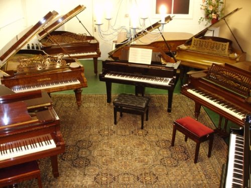 Some of Rochford Pianos grand pianos for sale in the main Showroom